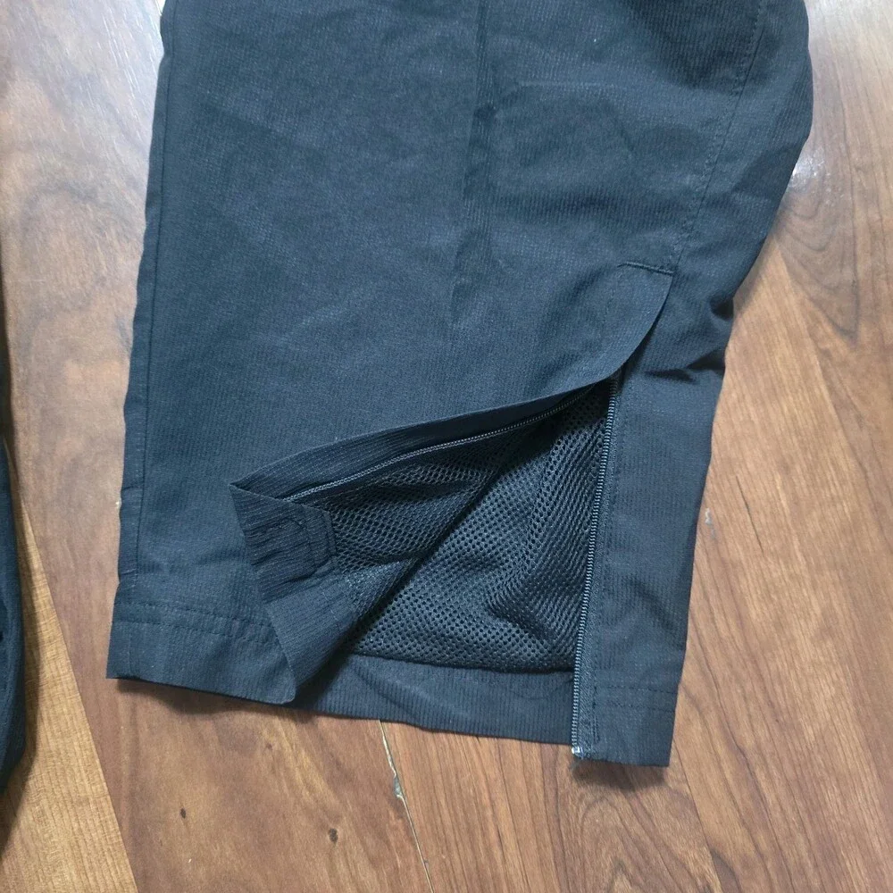 Under Armour Mens 3XL Black Loose Fit Mesh Lined Woven Track Pants Zipper Ankle